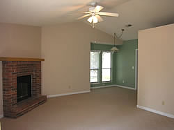 living room with fireplace and high cathedral ceilings. Very open floor plan.